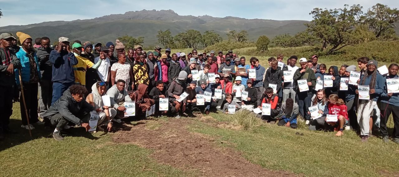 Our crew and trekkers beneath Mount Kenya